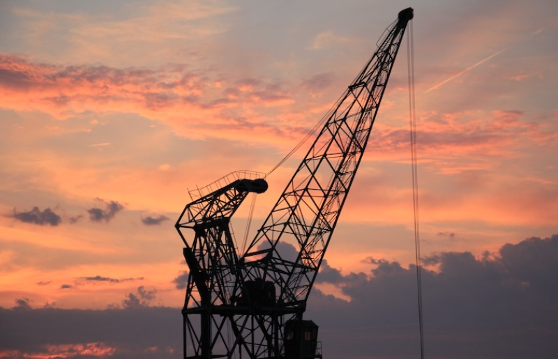 crane against sunrise backdrop